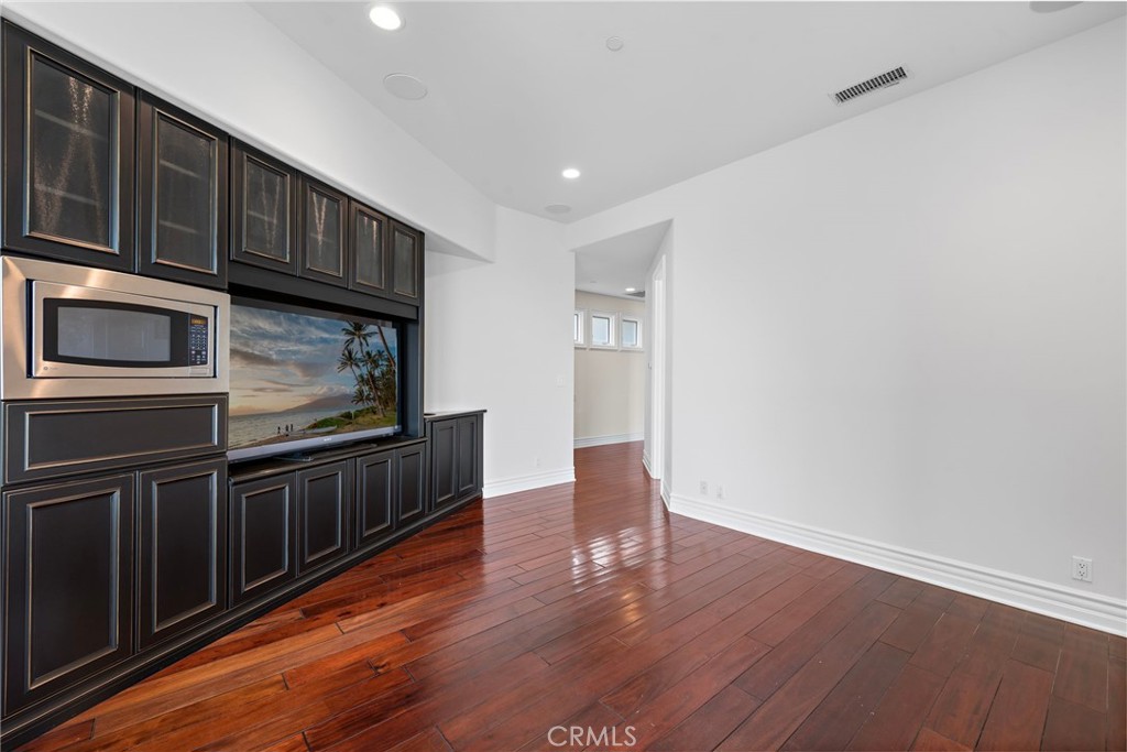 14 Mar Del Rey San Clemente, CA 92673 - Photo 52 of 70 a kitchen with stainless steel appliances granite countertop a refrigerator a stove and a wooden floors