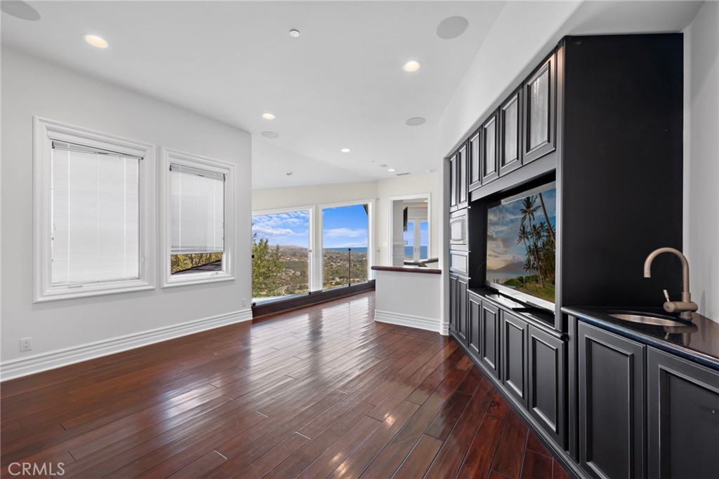 14 Mar Del Rey San Clemente, CA 92673 - Photo 53 of 70 a view of a hallway with wooden floor and windows