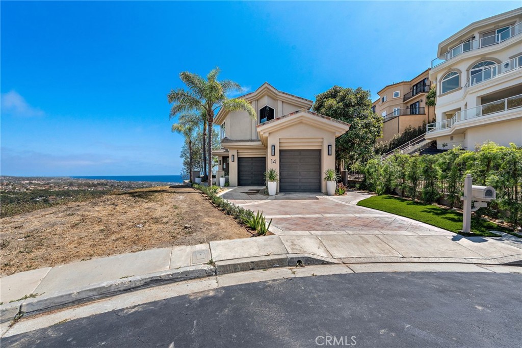 14 Mar Del Rey San Clemente, CA 92673 - Photo 65 of 70 a front view of a house with a yard and garage