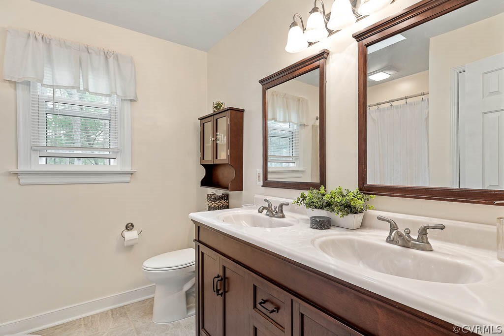 13813 Shadow Ridge Road Midlothian, VA 23112 - Photo 23 of 49 a bathroom with double sink and a mirror