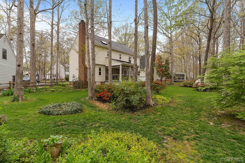 13813 Shadow Ridge Road Midlothian, VA 23112 - Photo 34 of 49 a view of a house with a big yard and large trees