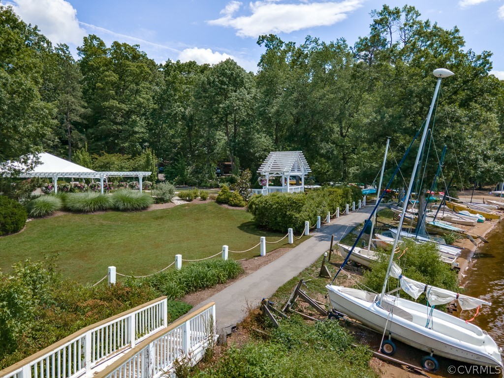 13813 Shadow Ridge Road Midlothian, VA 23112 - Photo 45 of 49 an aerial view of a house with swimming pool patio and lake view