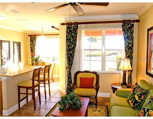 7590 Assembly Lane Reunion, FL 34747 - Photo 1 of 1 a outdoor living space with furniture and a potted plant