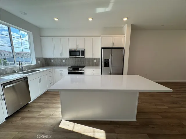 a bathroom with a sink toilet and a mirror