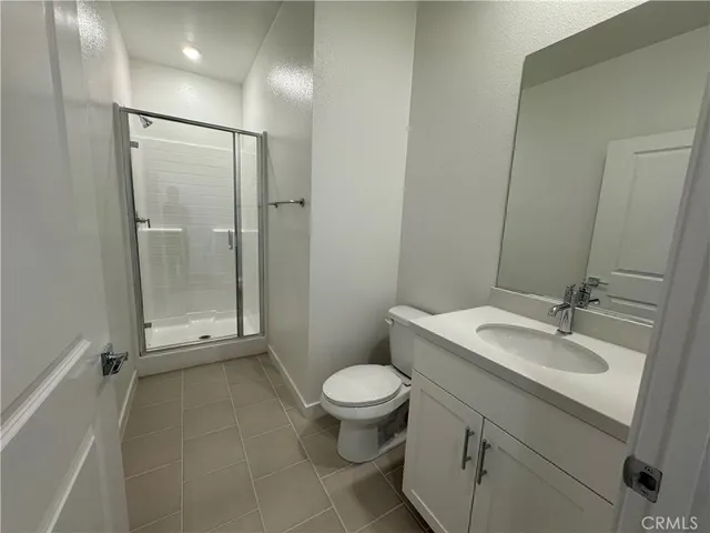 a kitchen with granite countertop white cabinets and sink
