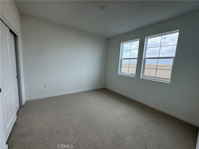 a view of a kitchen with wooden floor and a sink