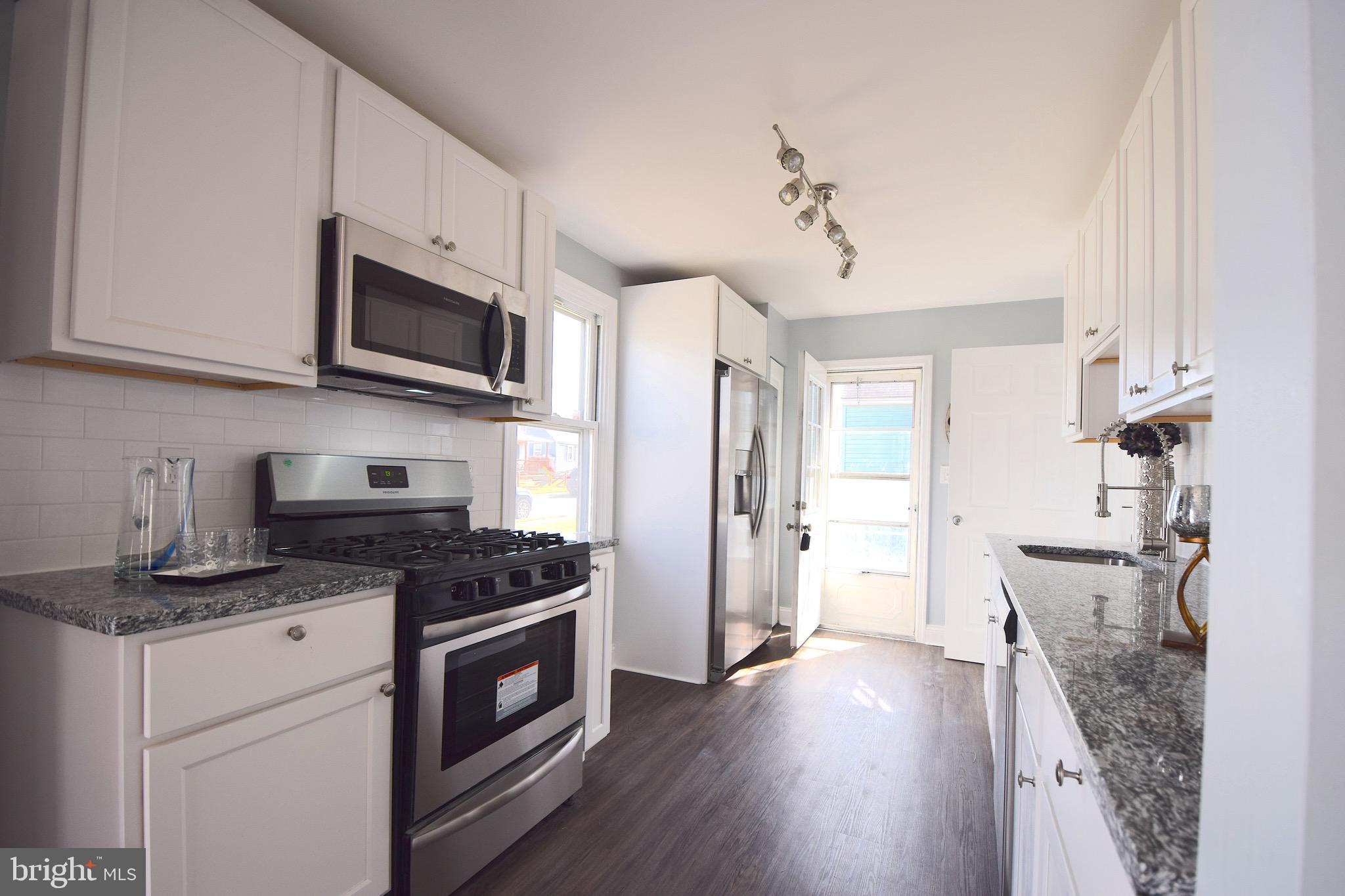 1752 Brookview Road Baltimore, MD 21222 - Photo 6 of 37 Galley Kitchen with Brand New SS Appliances