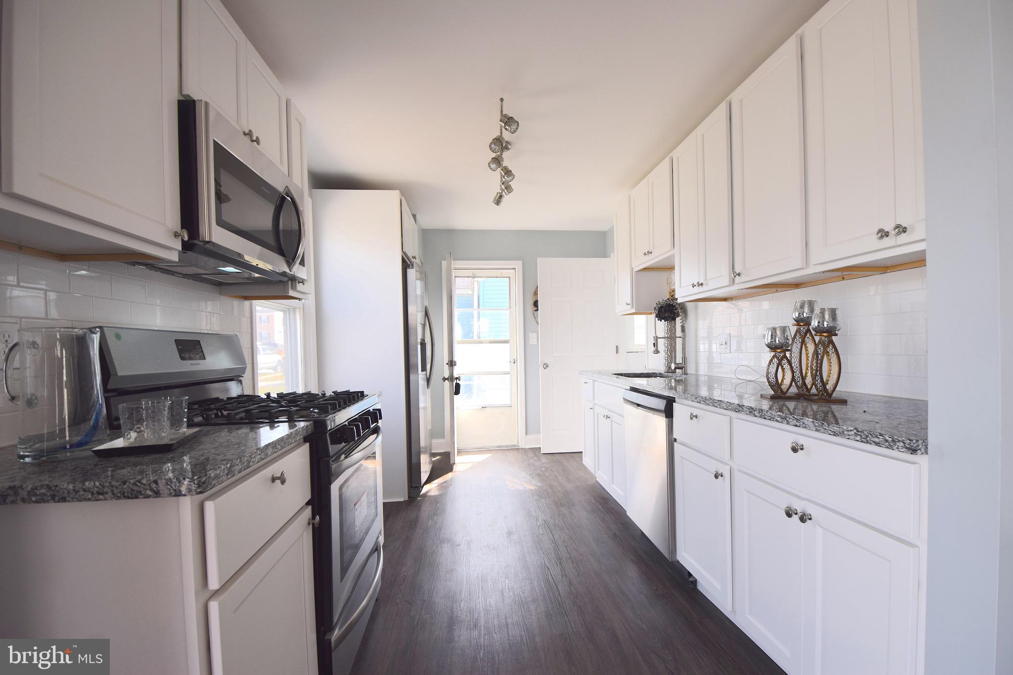 1752 Brookview Road Baltimore, MD 21222 - Photo 7 of 37 Galley Kitchen with Brand New SS Appliances