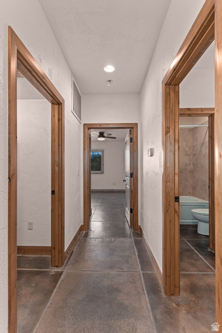 2464 East Granite Way St. George, UT 84790 - Photo 99 of 106 Corridor with a textured wall, concrete flooring, and recessed lighting