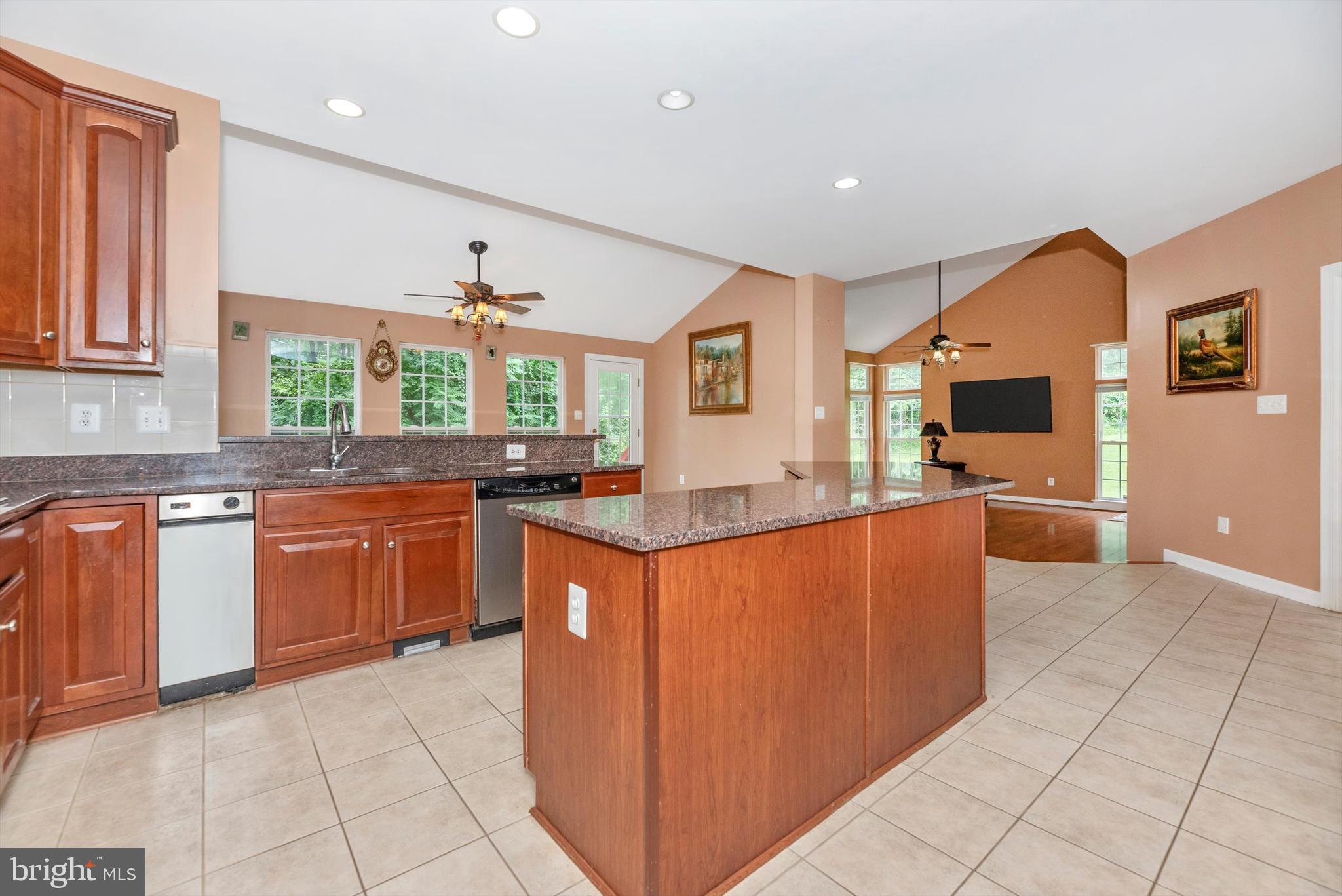 6636 South Clifton Road Frederick, MD 21703 - Photo 20 of 81 a kitchen with stainless steel appliances granite countertop a stove and a sink
