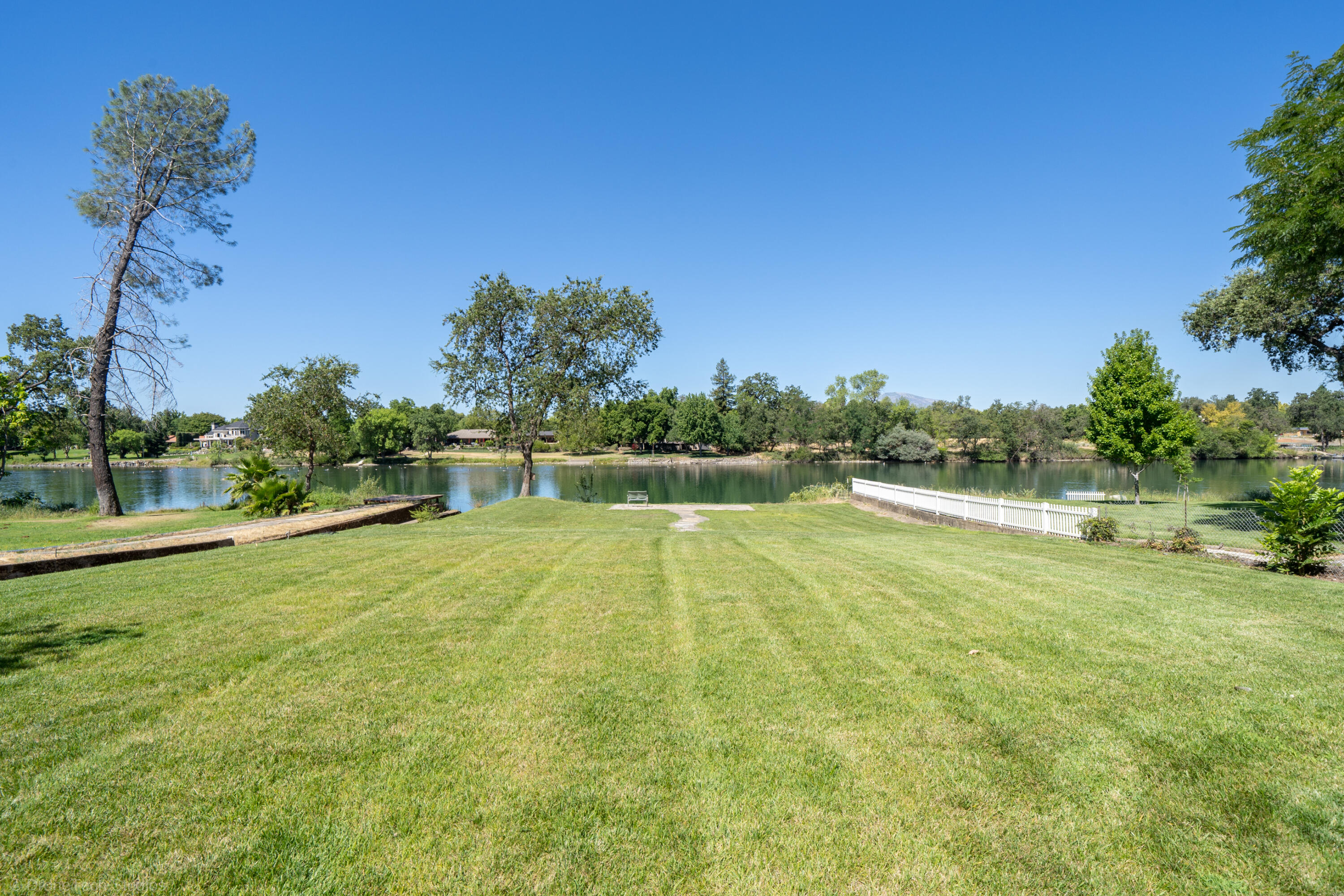 3274 Wilshire Drive Redding, CA 96002 - Photo 2 of 107 a view of a swimming pool with an outdoor space and seating area