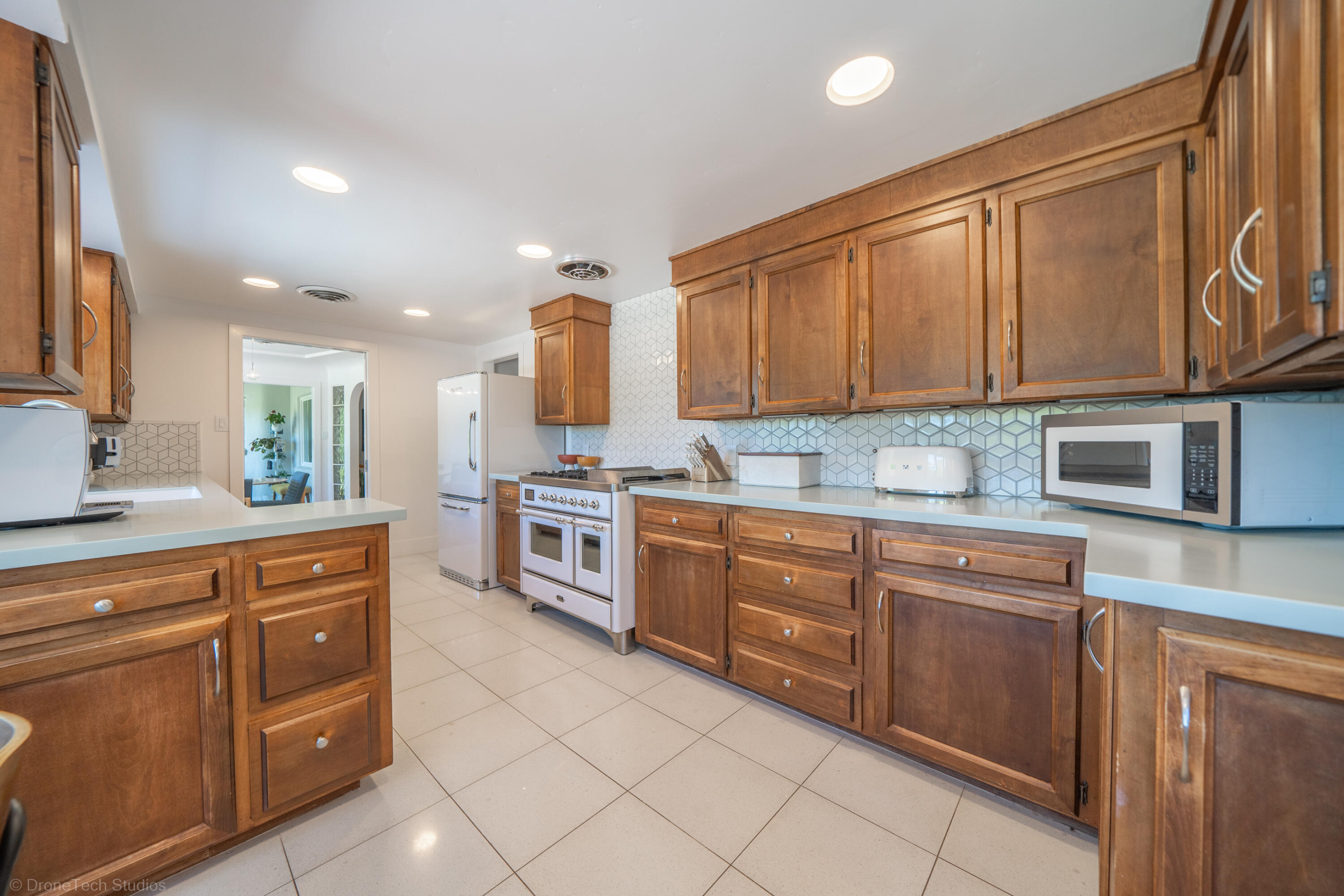 3274 Wilshire Drive Redding, CA 96002 - Photo 26 of 107 a kitchen with stainless steel appliances granite countertop a stove sink and cabinets