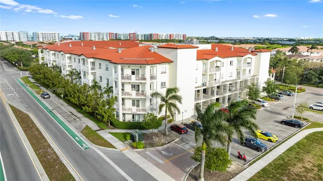 a view of swimming pool with outdoor seating and city view