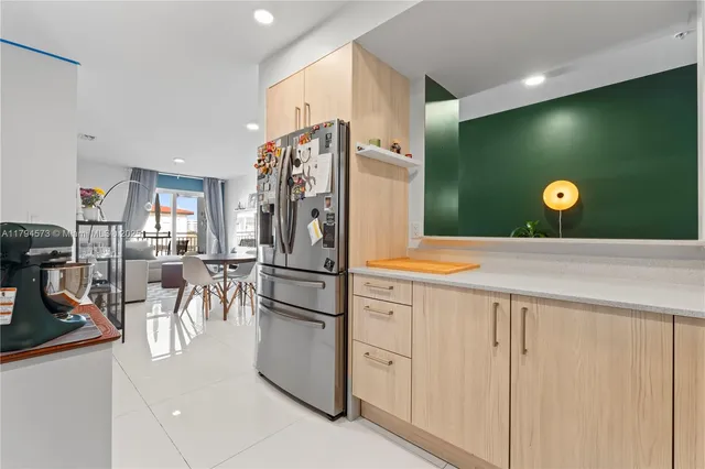 a utility room with sink dryer and washer