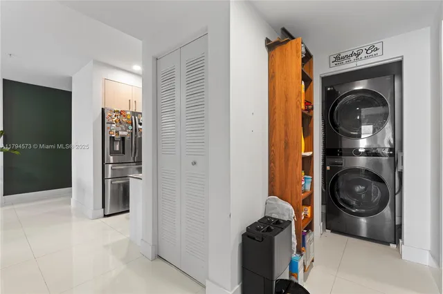 a living room with furniture potted plant and a window