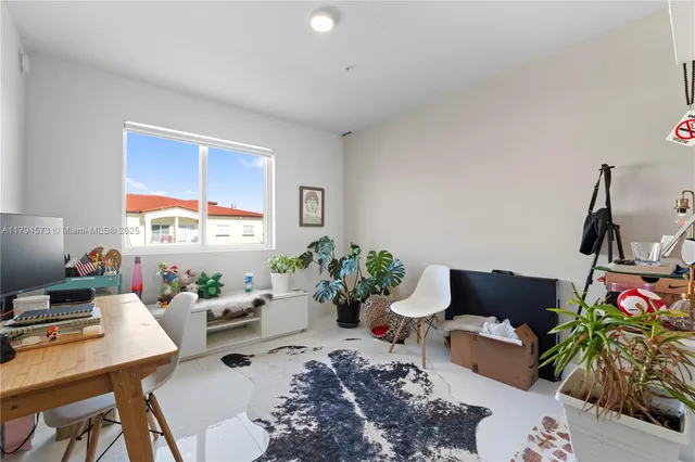 a workspace with furniture and wooden floor