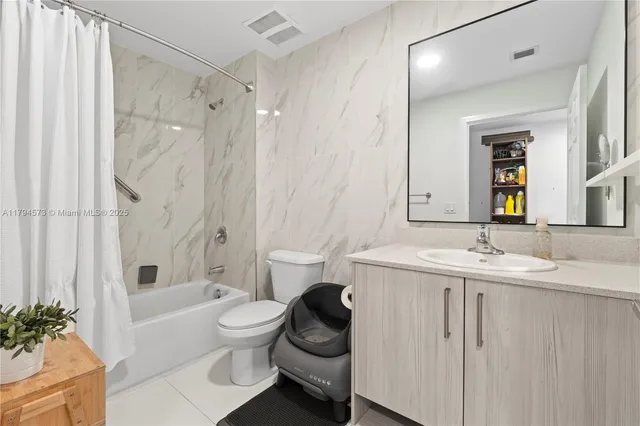 a view of room with furniture and wooden floor