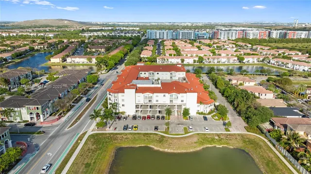 an aerial view of a house with a lake view