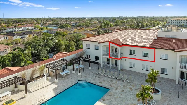 a view of a swimming pool with a terrace