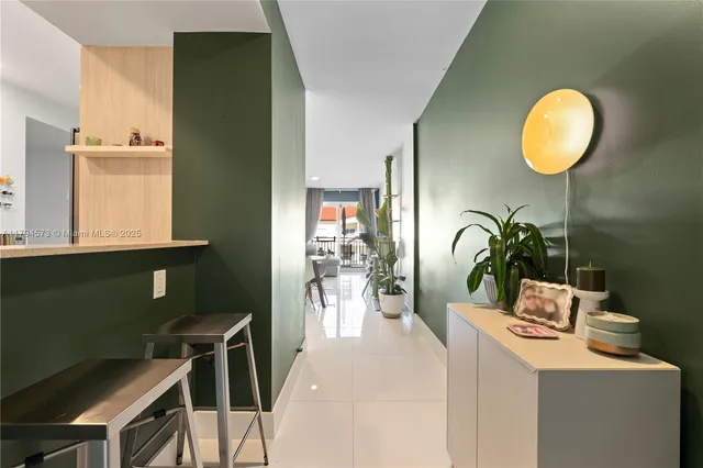 a view of a dining room with furniture and a window