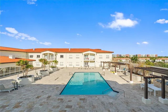 an aerial view of a house with a ocean view