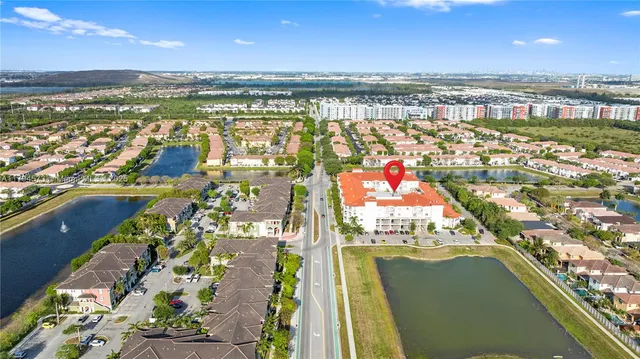 an aerial view of residential houses with outdoor space