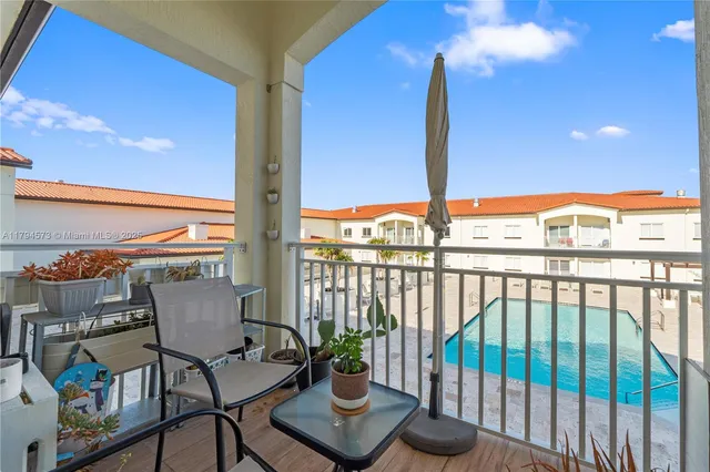 a kitchen with stainless steel appliances a refrigerator sink and cabinets
