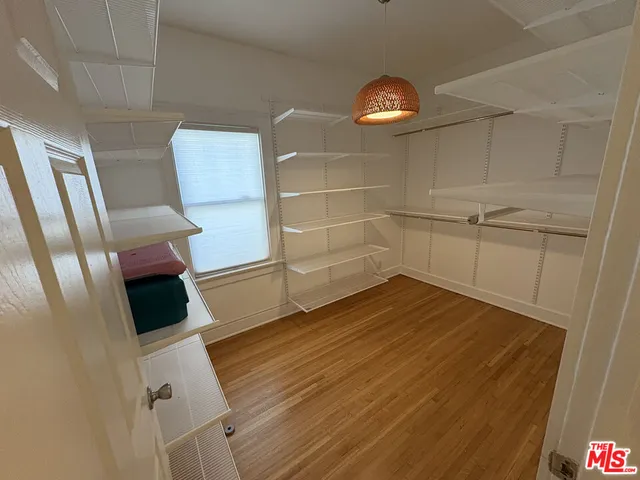 a view of a room with wooden floor and staircase