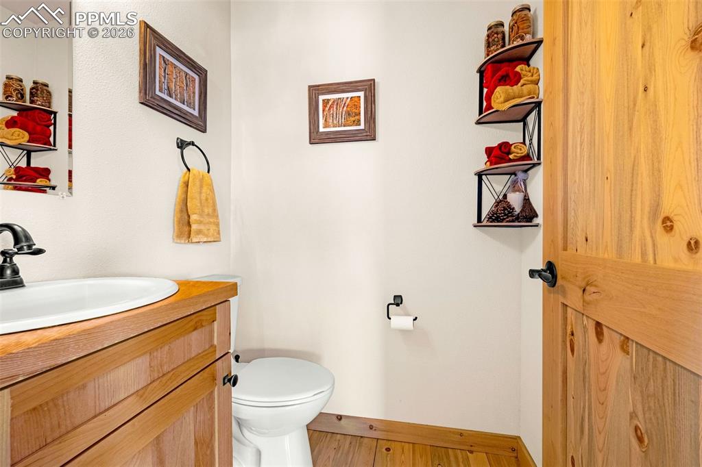 8480 Delaware Road Colorado Springs, CO 80926 - Photo 18 of 49 Half bath located in the main living open space for guests