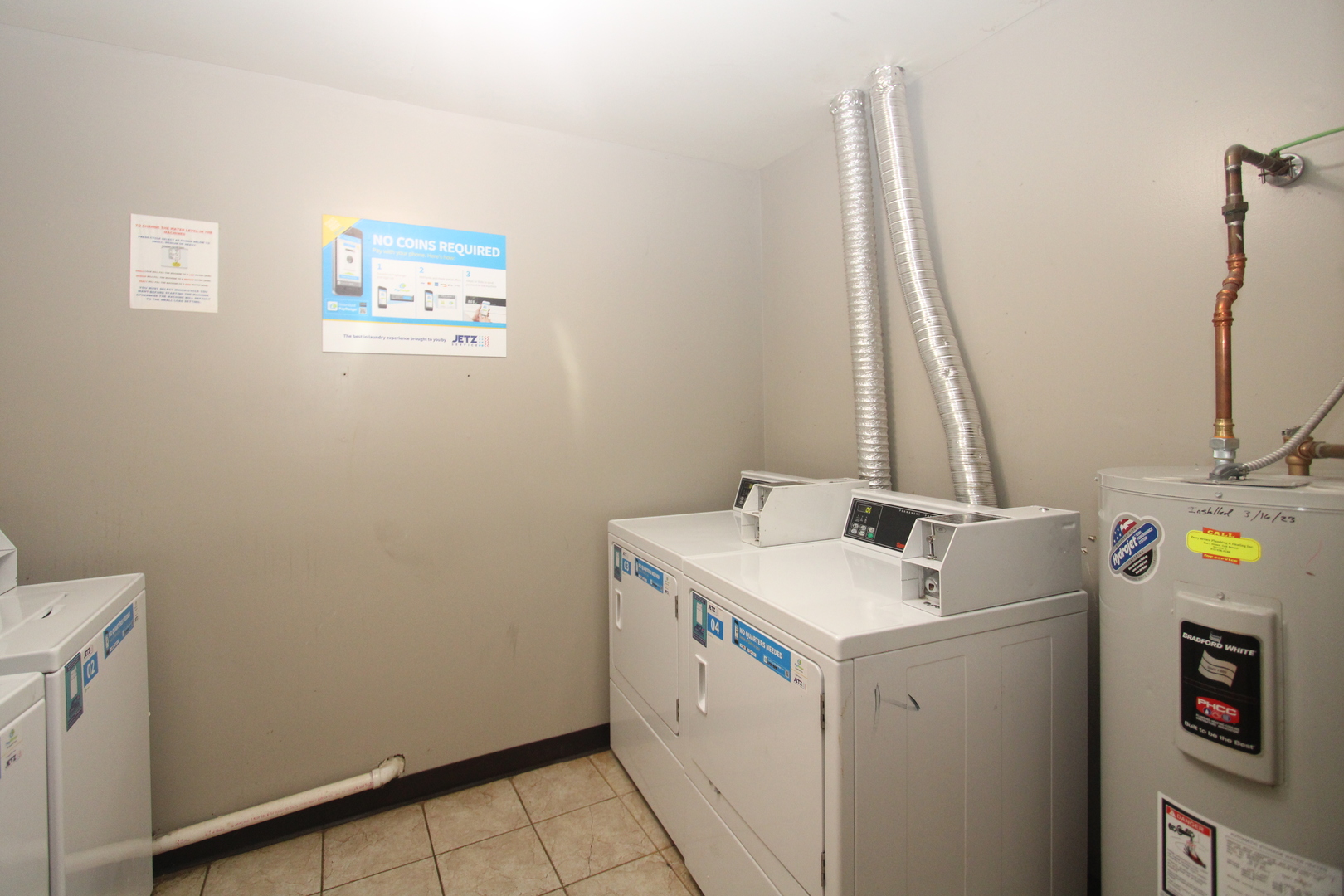 212 Madison Street, Unit 1B Joliet, IL 60435 - Photo 15 of 21 a utility room with dryer and washer