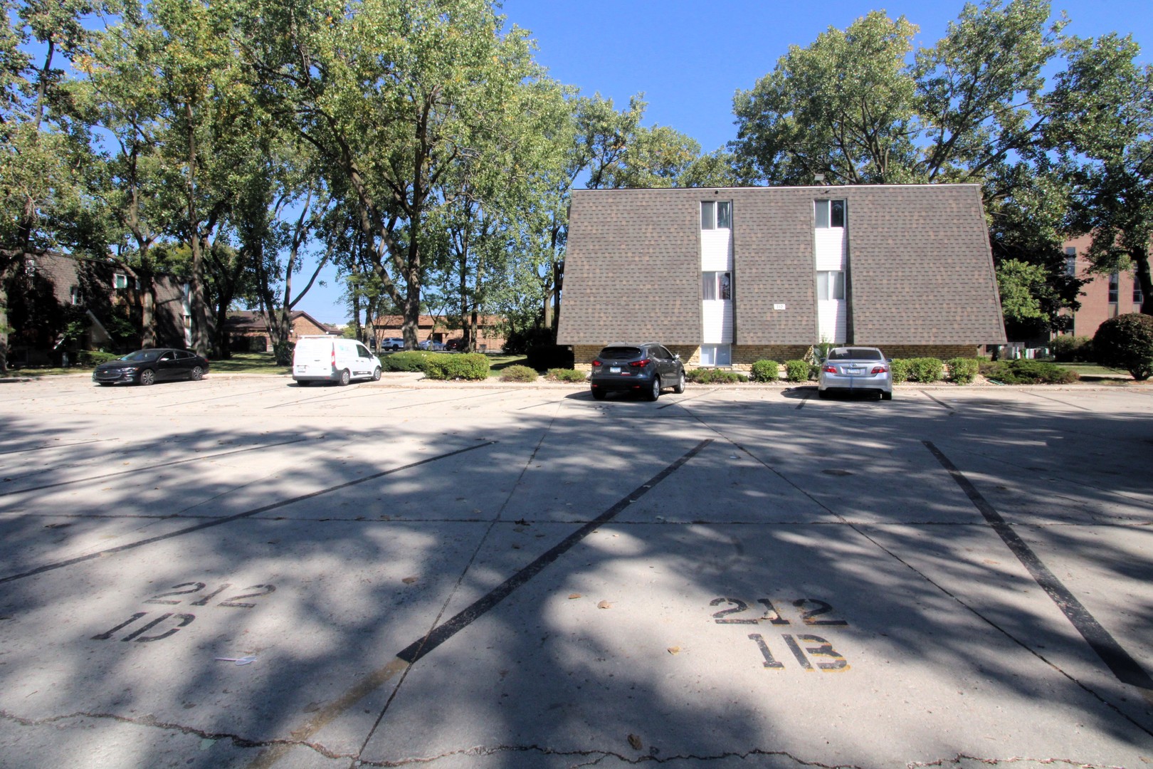 212 Madison Street, Unit 1B Joliet, IL 60435 - Photo 20 of 21 a view of a house with a yard