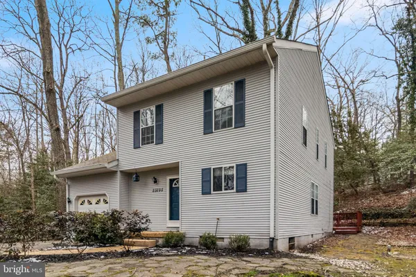 a view of balcony with wooden floor and fence