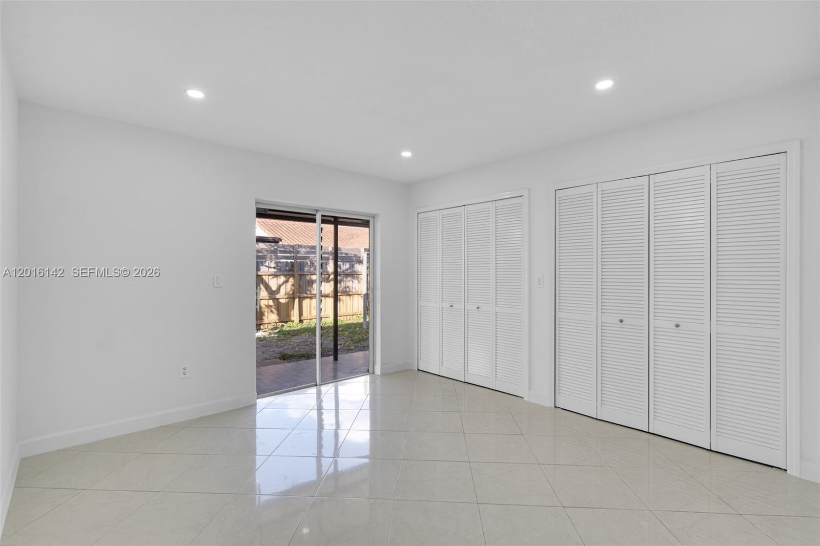 14755 Southwest 82nd Terrace Miami, FL 33193 - Photo 13 of 32 a view of an empty room with a window