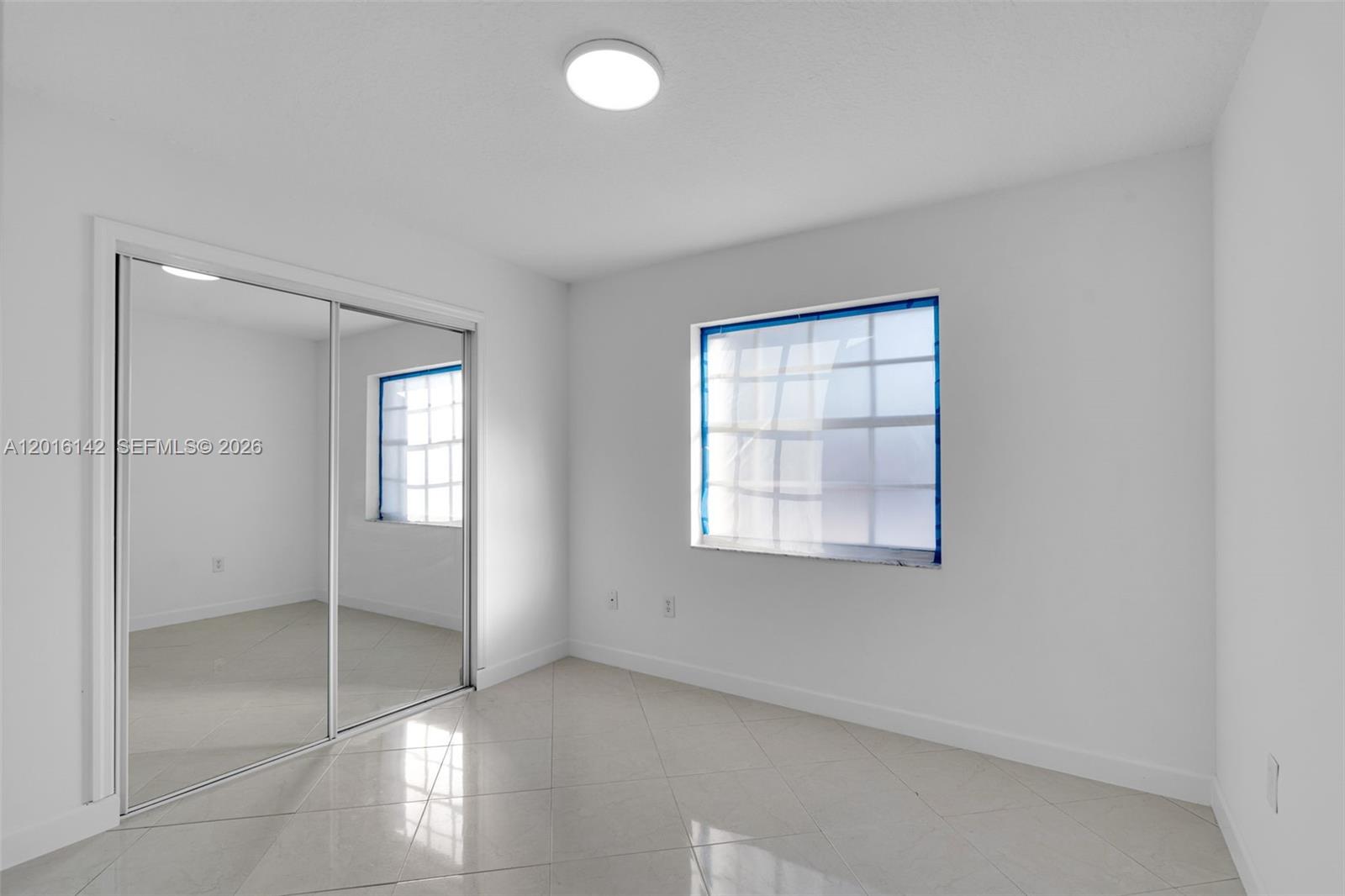 14755 Southwest 82nd Terrace Miami, FL 33193 - Photo 20 of 32 an empty room with windows