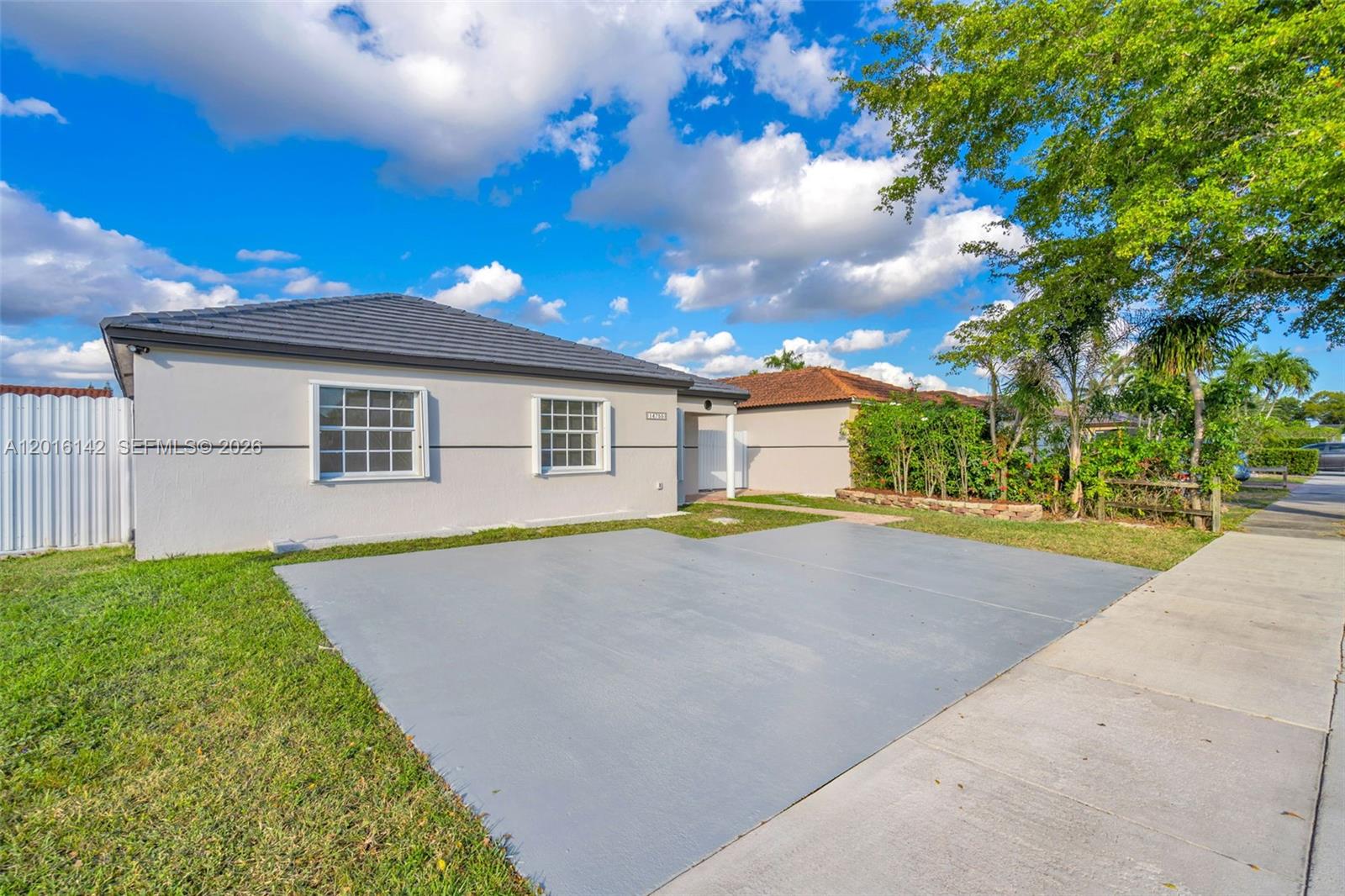 14755 Southwest 82nd Terrace Miami, FL 33193 - Photo 2 of 32 a house view with a backyard space