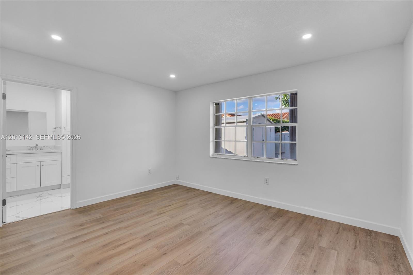 14755 Southwest 82nd Terrace Miami, FL 33193 - Photo 24 of 32 wooden floor in an empty room with a window