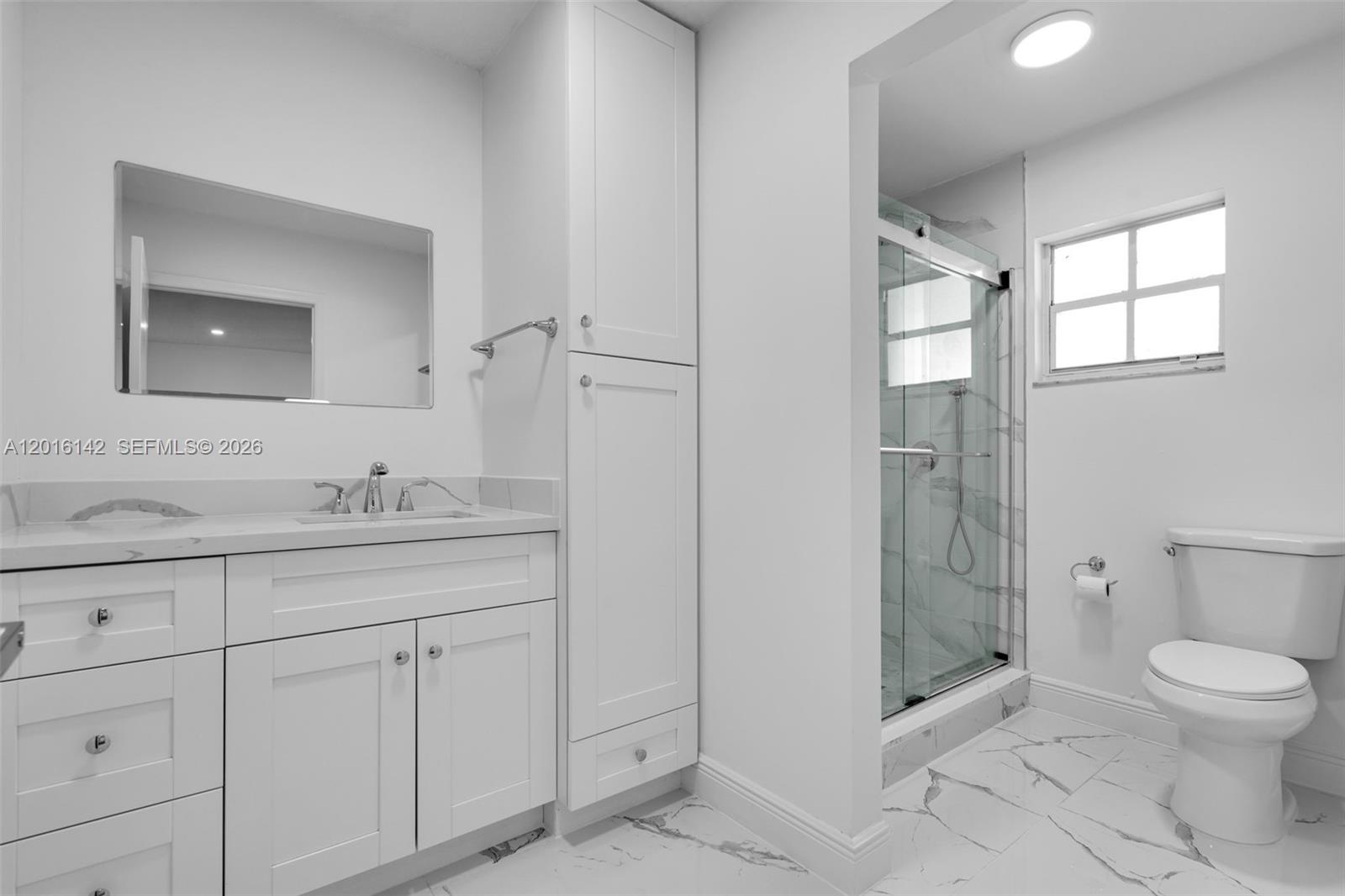 14755 Southwest 82nd Terrace Miami, FL 33193 - Photo 26 of 32 a bathroom with a granite countertop sink toilet and shower