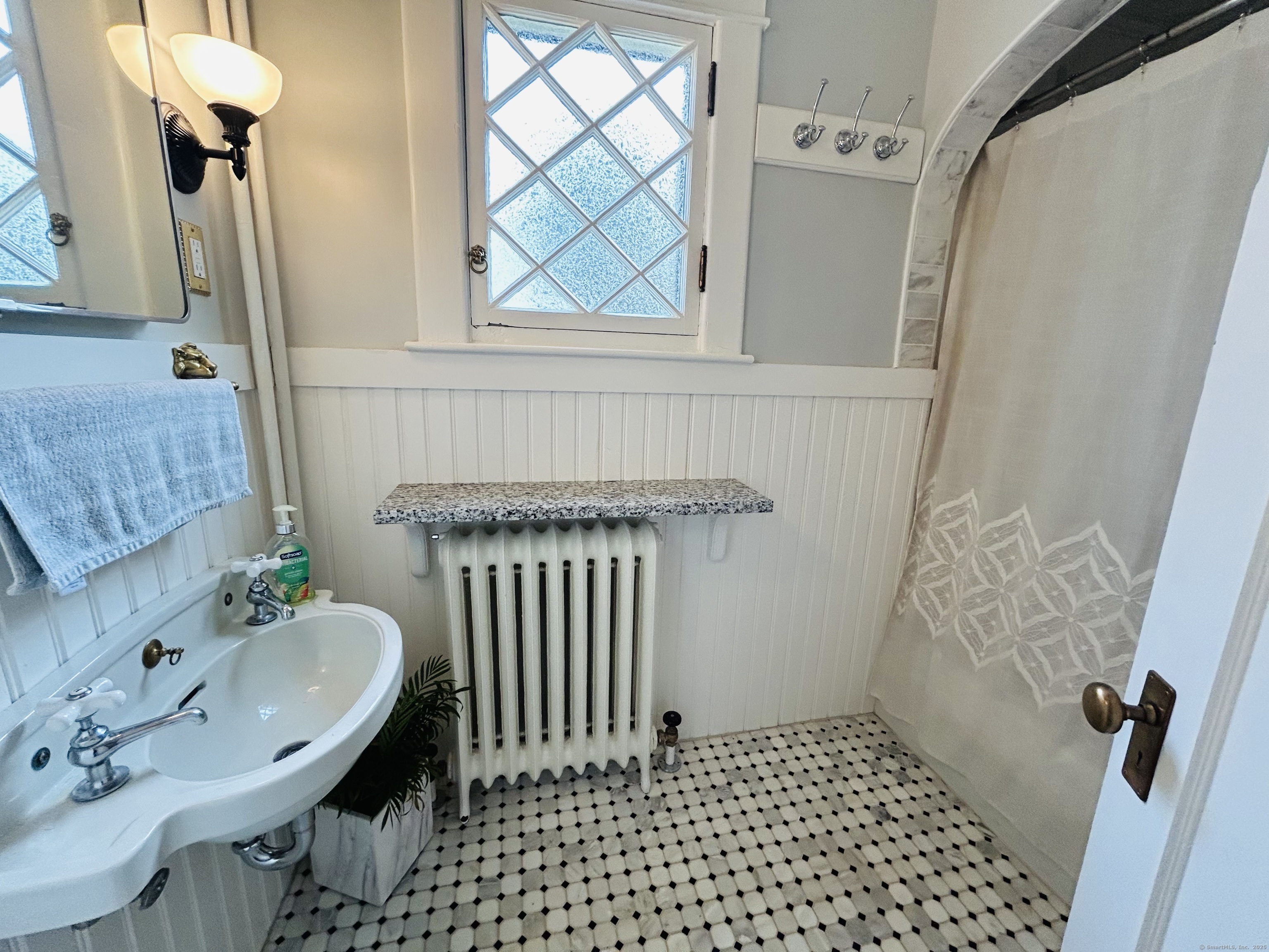 37 School Street Enfield, CT 06082 - Photo 11 of 15 a bathroom with a sink and a mirror