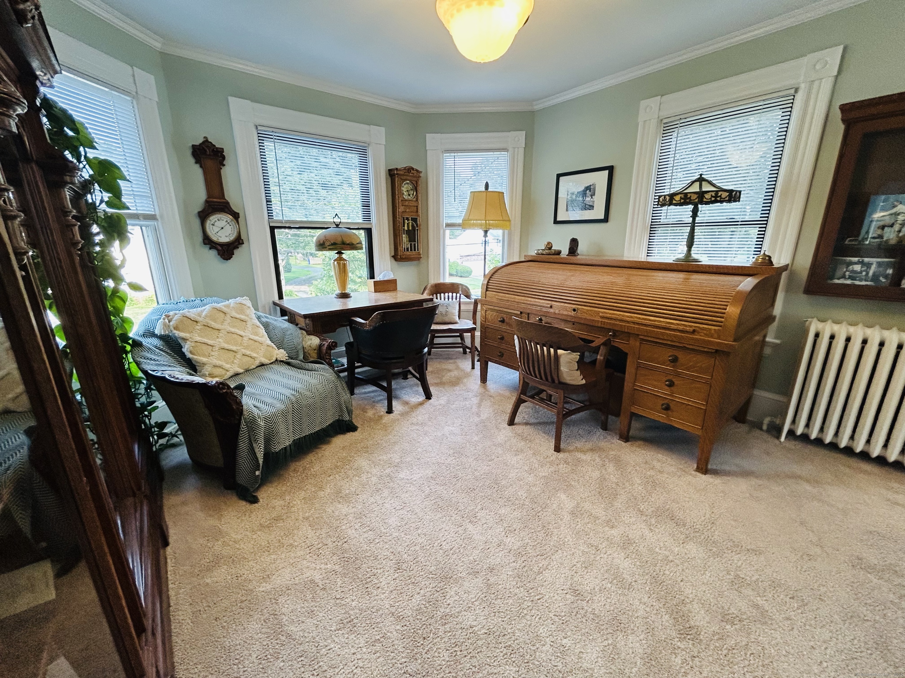 37 School Street Enfield, CT 06082 - Photo 13 of 15 a living room with furniture and a flat screen tv