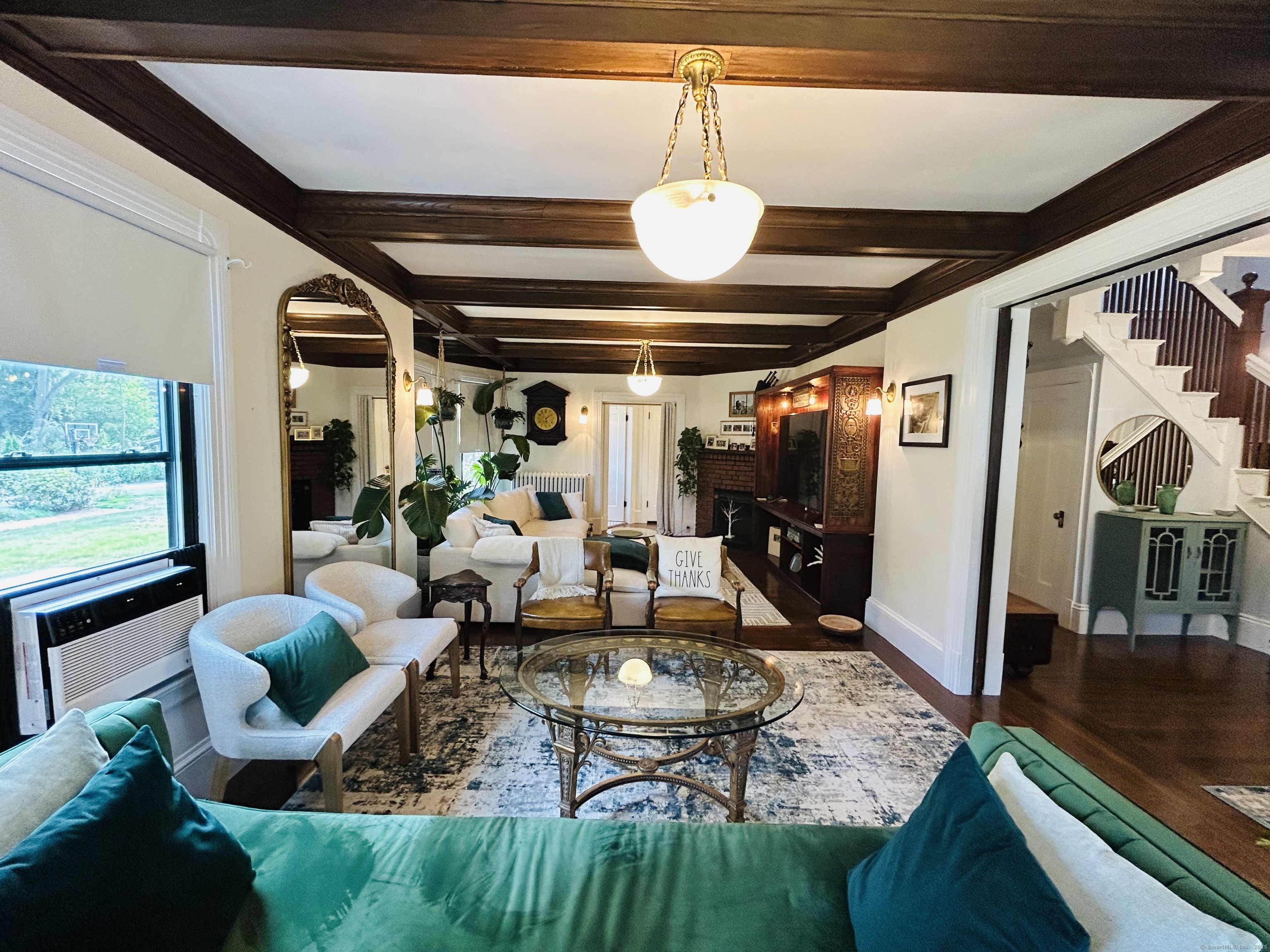 37 School Street Enfield, CT 06082 - Photo 5 of 15 a living room with lots of furniture and a chandelier