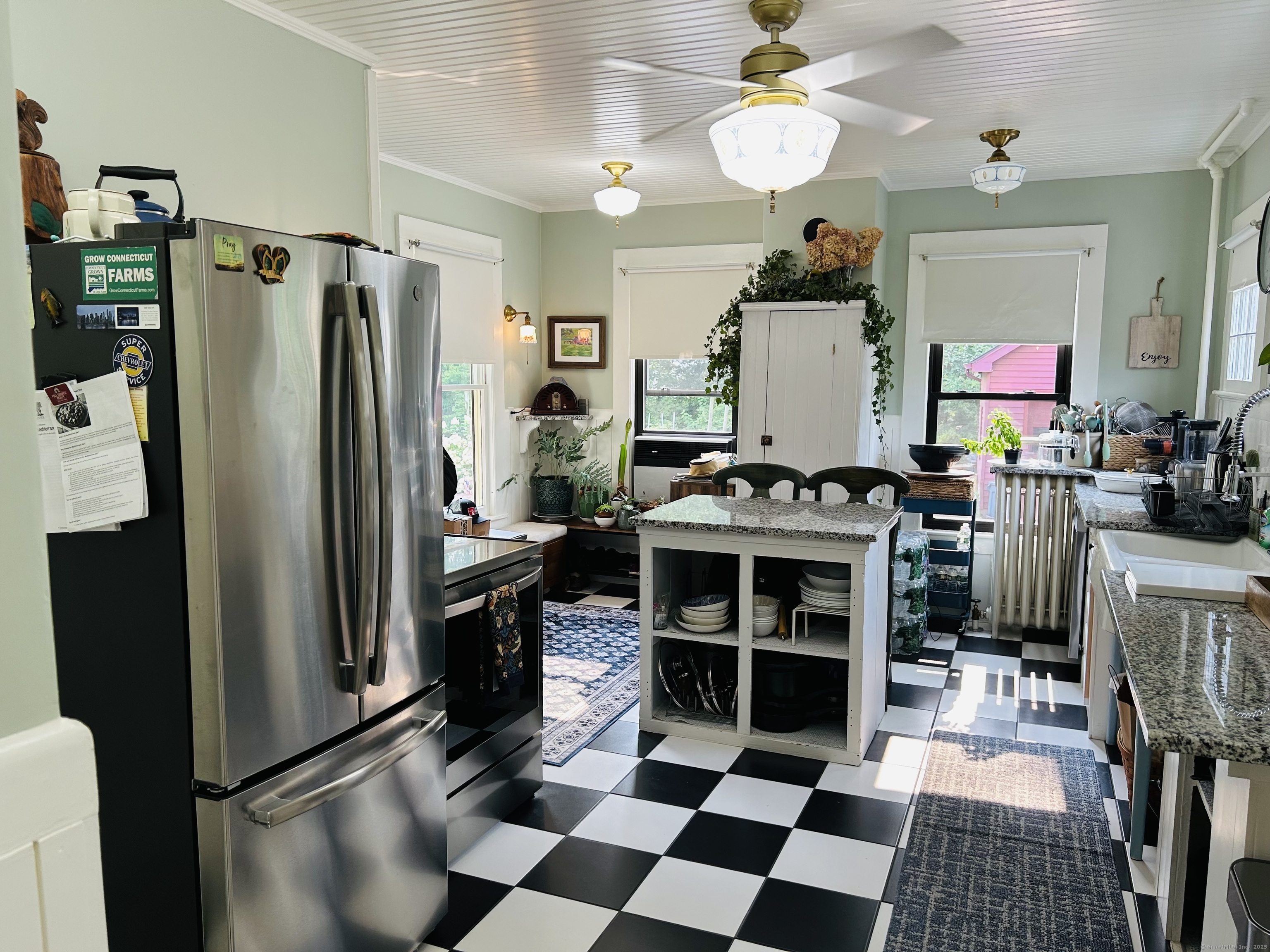37 School Street Enfield, CT 06082 - Photo 7 of 15 a kitchen with stainless steel appliances granite countertop a refrigerator a stove and a sink with granite countertops