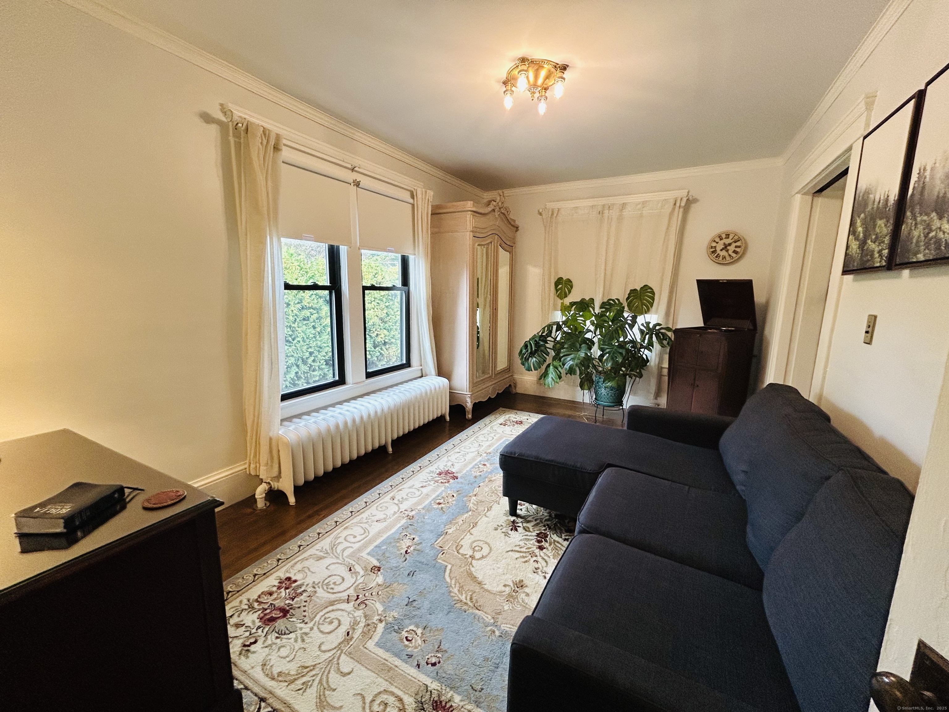 37 School Street Enfield, CT 06082 - Photo 9 of 15 a living room with furniture and a window