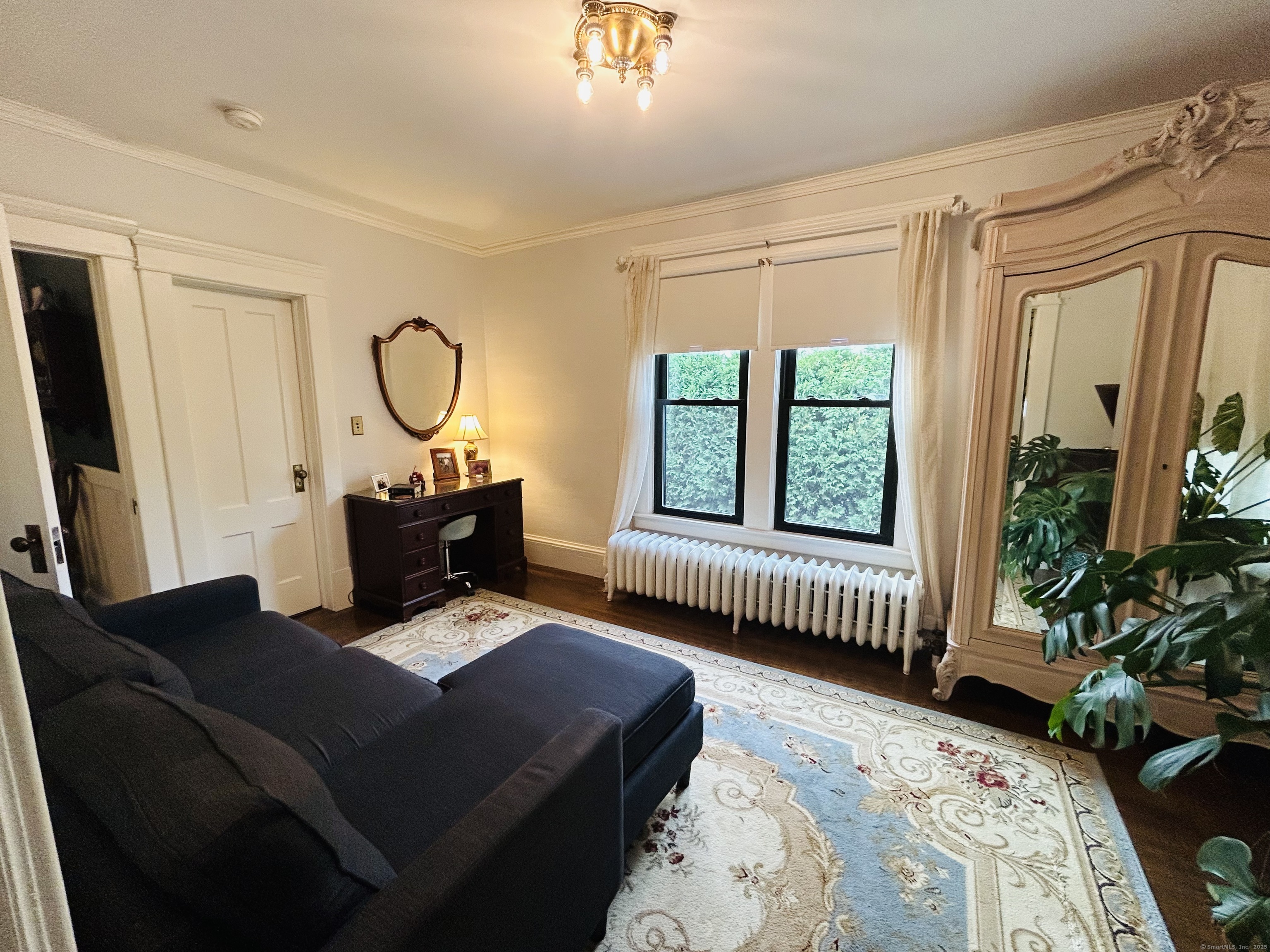 37 School Street Enfield, CT 06082 - Photo 10 of 15 a living room with furniture lamp and a window