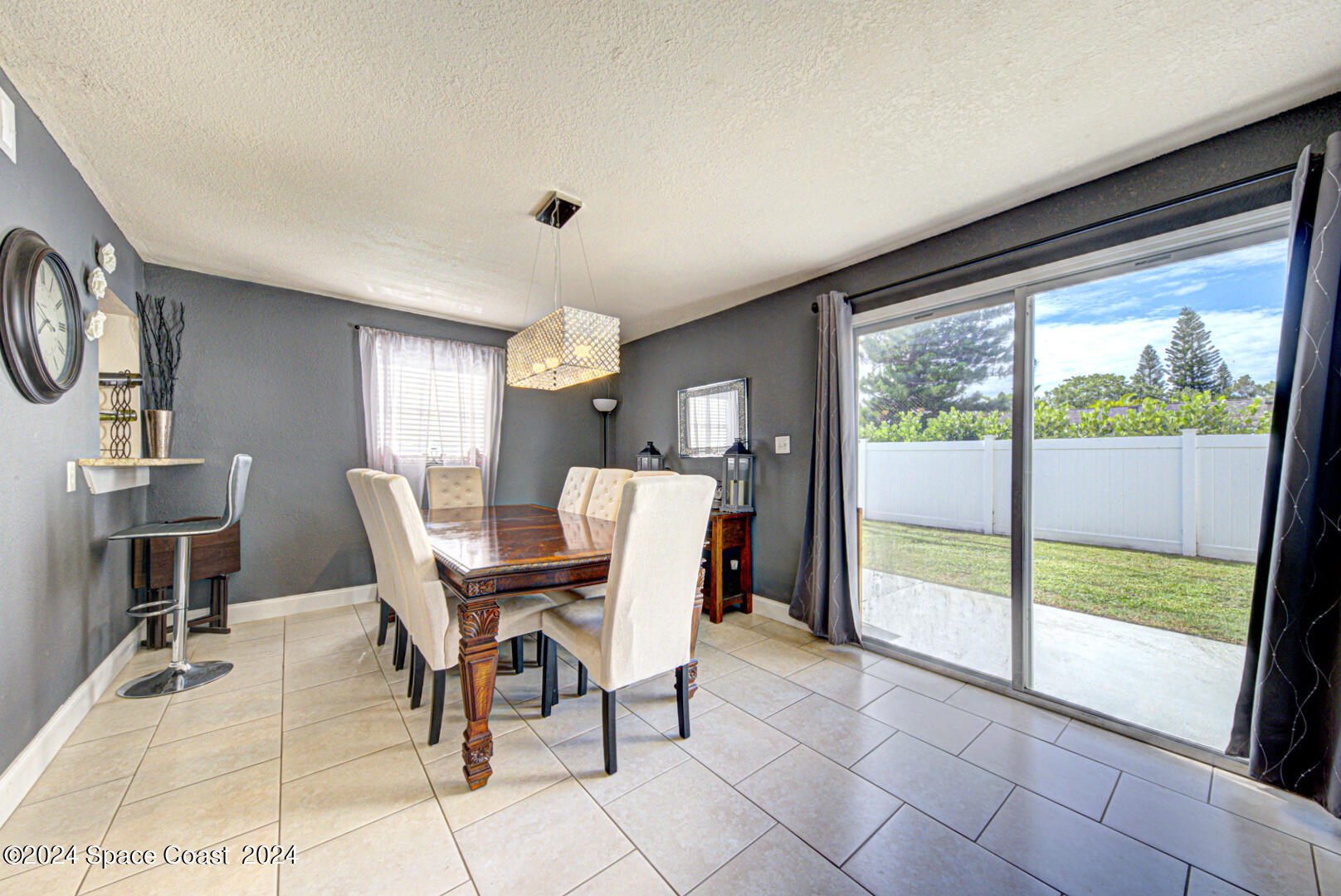 1025 Illinois Road Cocoa, FL 32927 - Photo 16 of 38 dining room with slider to backyard