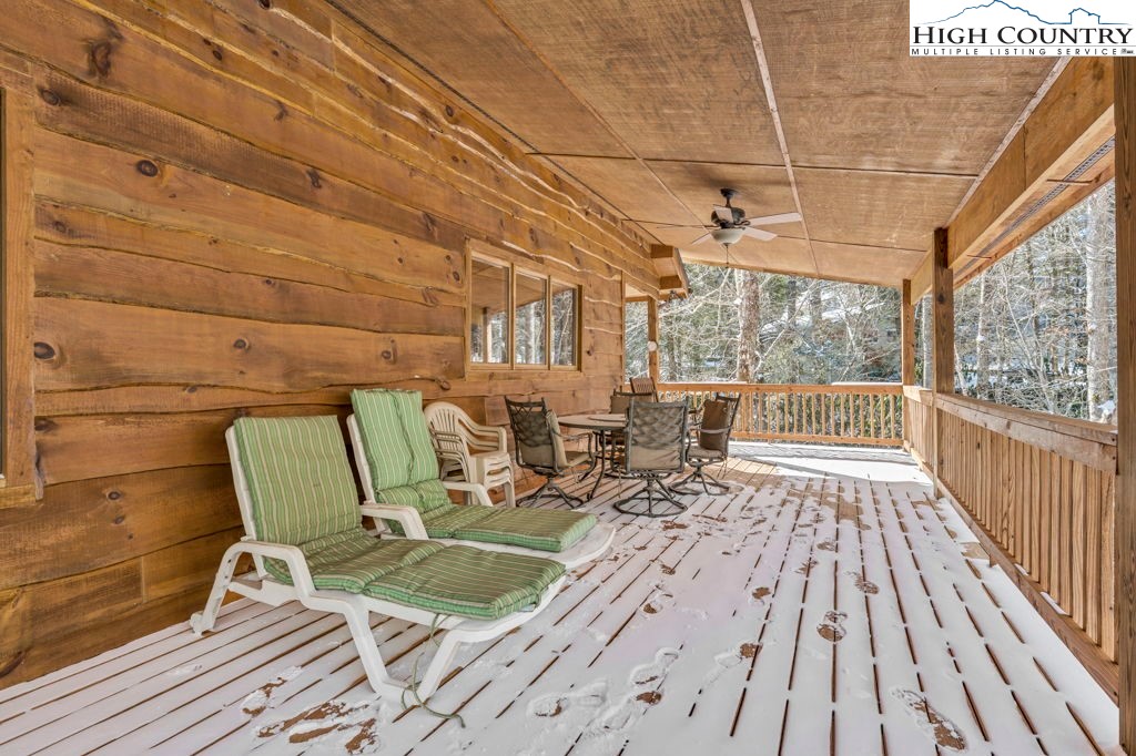 173 Spring Brook Road Newland, NC 28657 - Photo 34 of 39 a balcony with wooden floor and outdoor seating