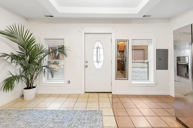 a view of an entryway with wooden floor