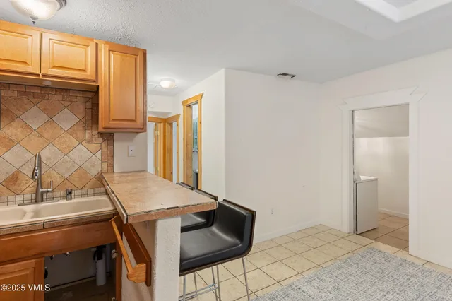 a room with a table and chairs