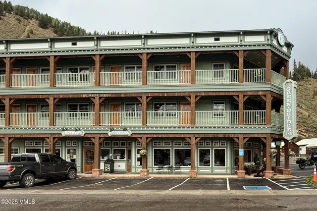 a front view of a building with a parking space