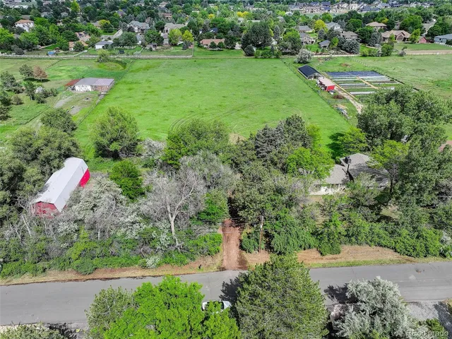 a view of a play ground with a white house