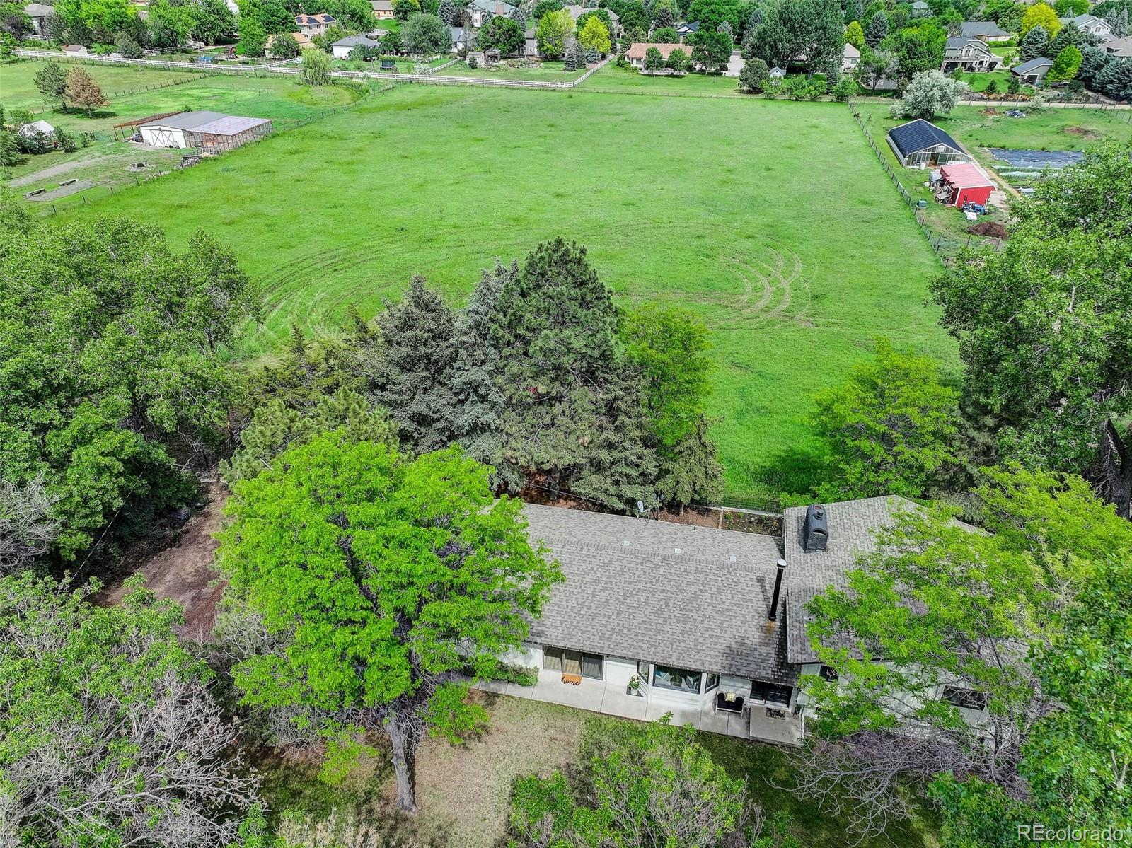 14650 Tejon Street Broomfield, CO 80023 - Photo 2 of 39 an aerial view of a house with a yard and lake view